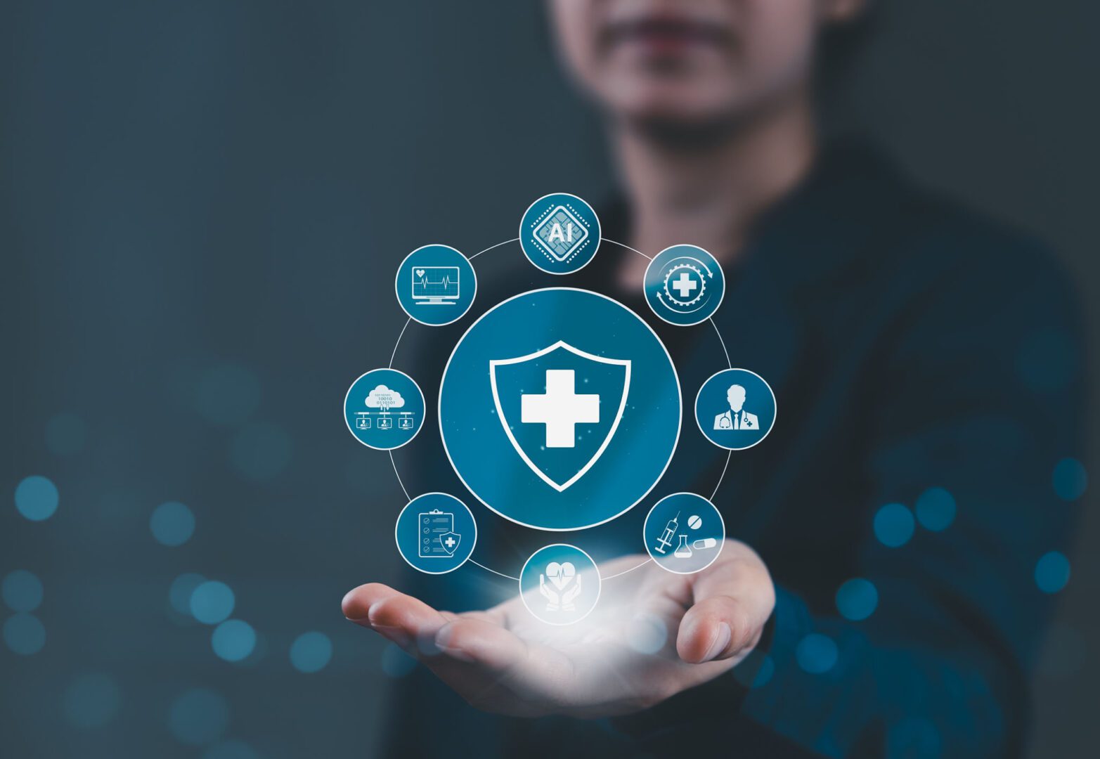 Digital healthcare icons floating above hand.