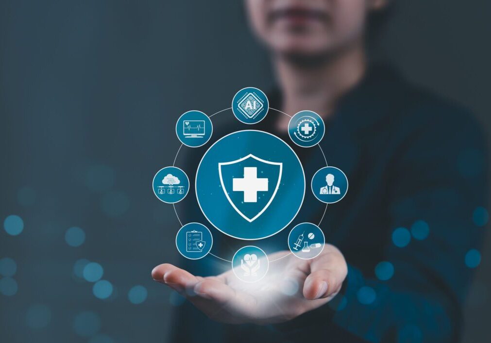 Digital healthcare icons floating above hand.